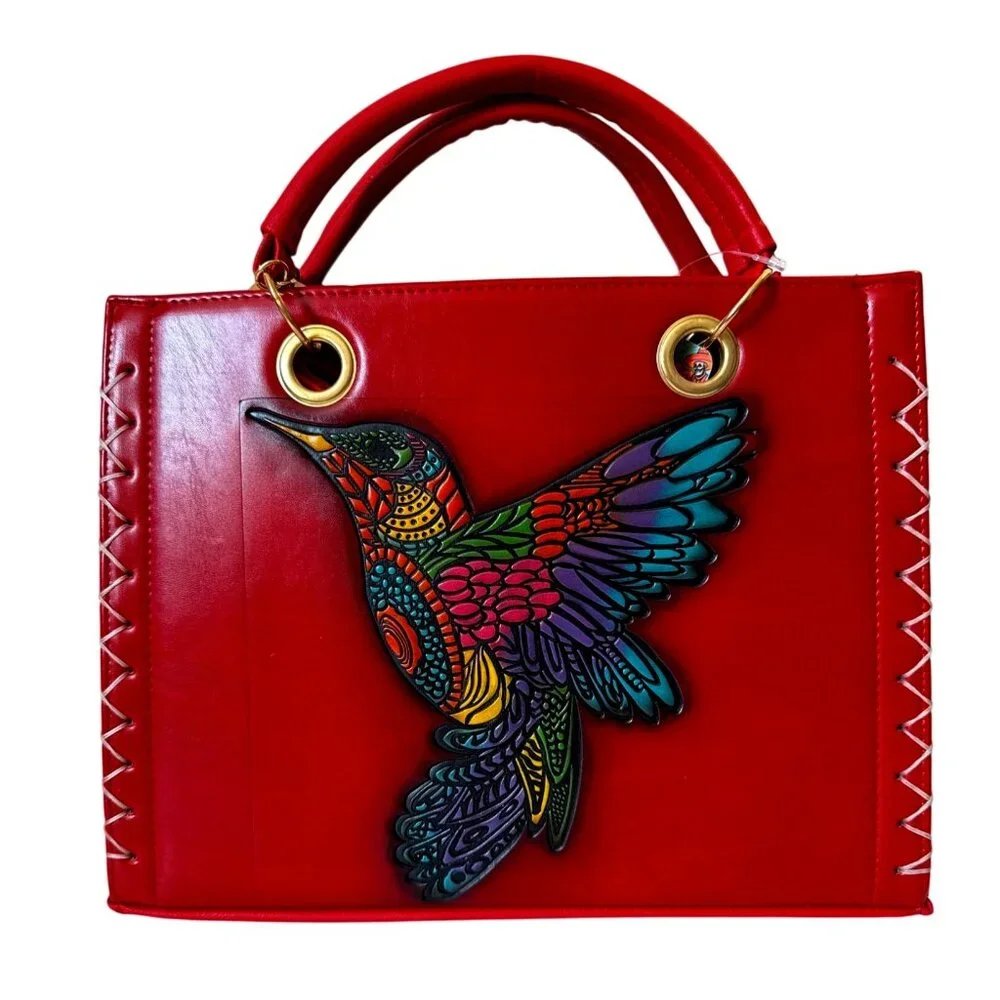 Tooled multicolored hummingbird on a vegan leather  red satchel with make up bag